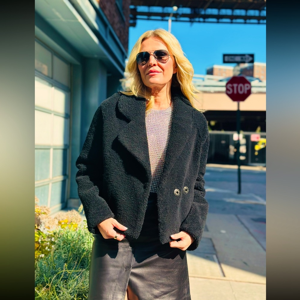 Black stylish sheep skin jacket , snaps closure , size mediumum